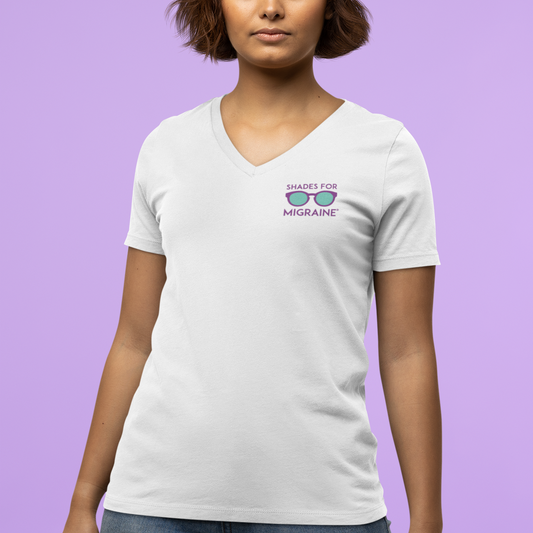 White v-neck ladies t-shirt with Shades for Migraine logo on left pocket area